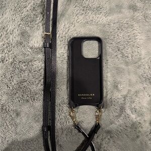 Bandolier Black and Gold iPhone 15 Pro Case with Strap